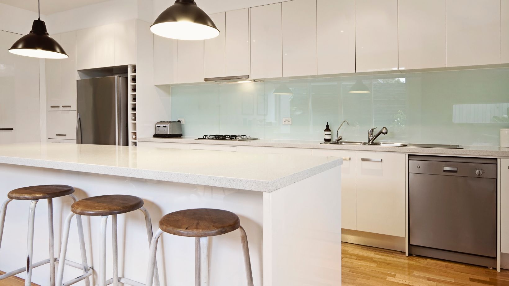 A kitchen with a white kitchen island