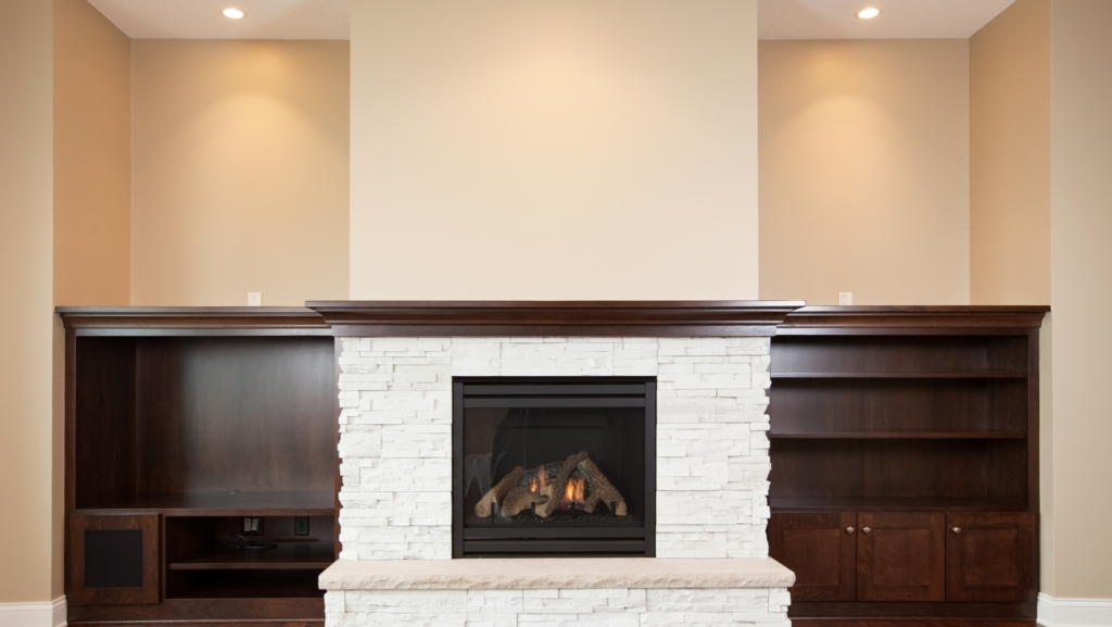 Built-in shelves surrounding a fire place